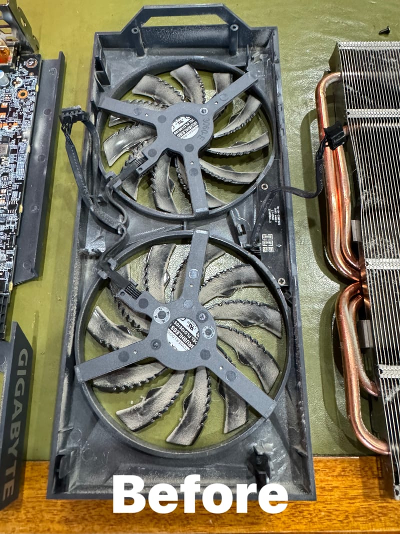 GPU fans clogged with thick dust before cleaning