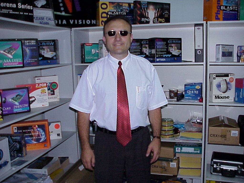 Senad with product shelves at Austar Computers